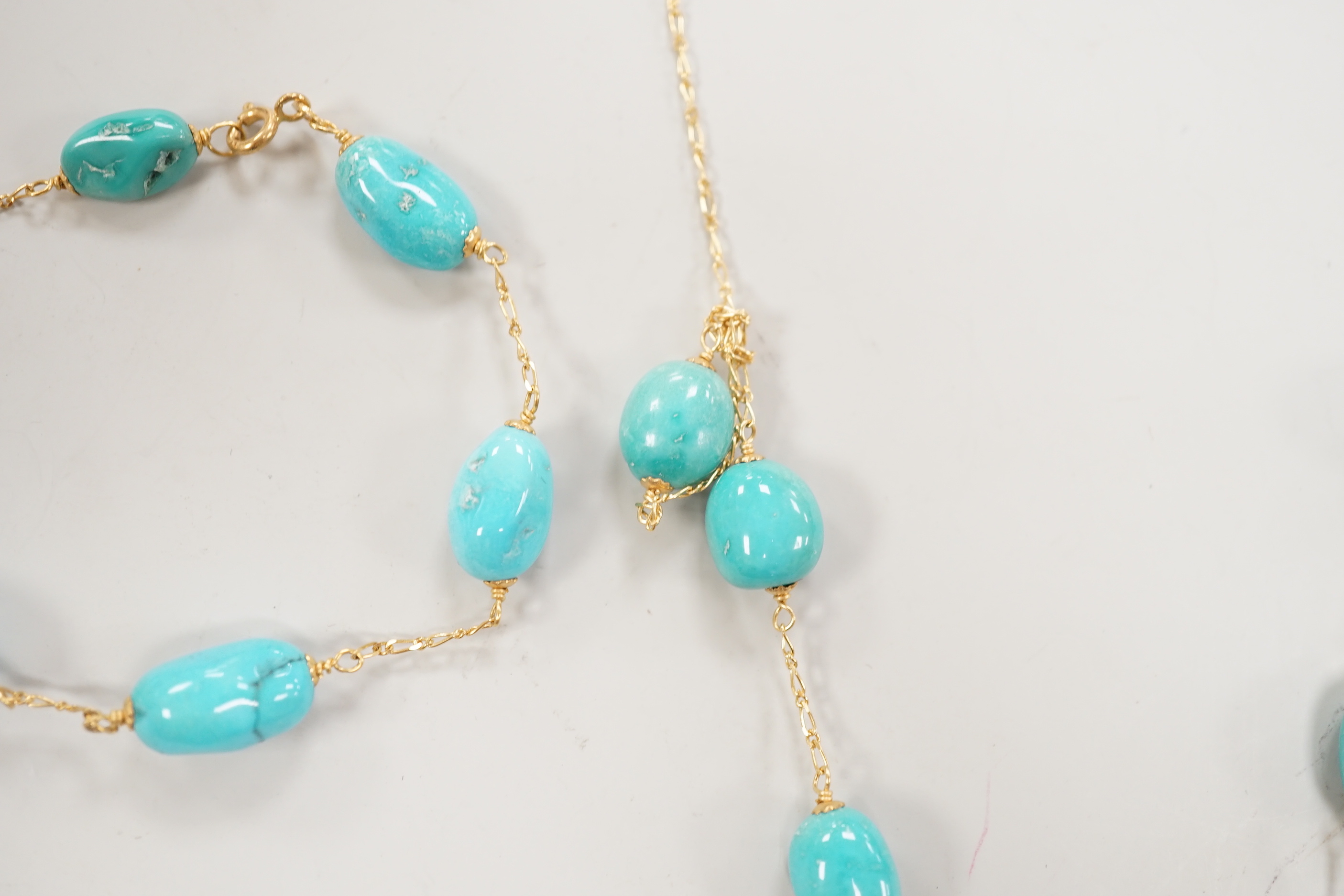 A modern Italian 750 and turquoise bead set necklace and matching bracelet, (necklace knotted) and a pair of similar enamelled? earrings, gross weight 29.4 grams.